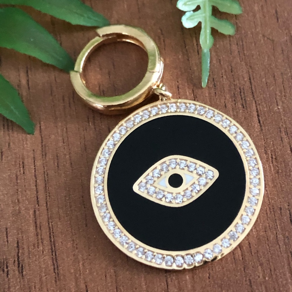 Black eye shaped necklace or an earing!